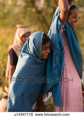 Stock Photo - Smiling girls in India. Fotosearch