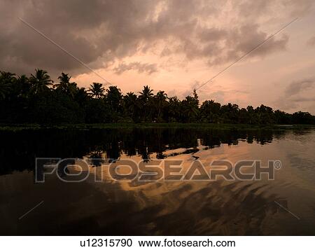 Stock Image - "Sunset Backwater, Kerala, South India". Fotosearch