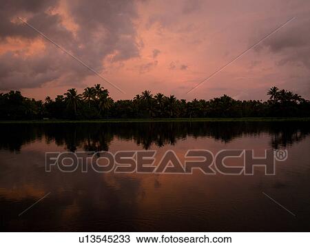 Stock Image - "Sunset Backwater, Kerala, South India". Fotosearch