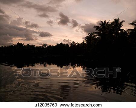 Stock Photo - "Sunset Backwater, Kerala, South India". Fotosearch