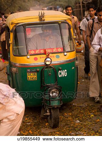 Stock Photo - "Tuk Tuk on street in Agra, India". Fotosearch