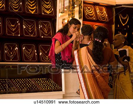 Stock Image - Women shopping in jewelry store. Fotosearch