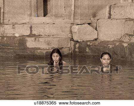 Women standing in Gange River in India View Large Photo Image Stock Photography - Women standing in Gange River in India. Fotosearch