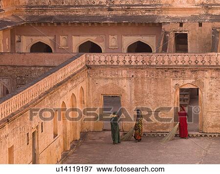 Stock Photo - "Women sweeping floor in Amber Fort, Jaipur, India". Fotosearch