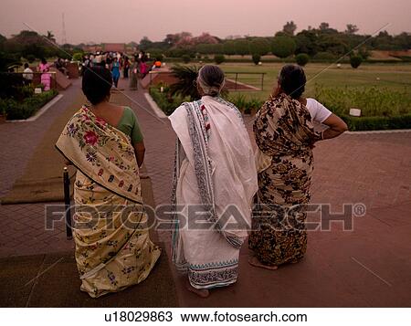Stock Image - Women wearing saris in Delhi India. Fotosearch