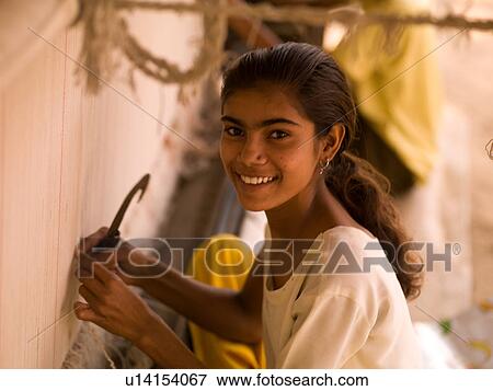 Young woman in India weaving View Large Photo Image Stock Photo - Young woman in India weaving. Fotosearch