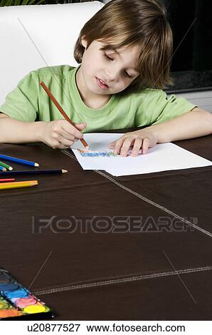 Boy drawing View Large Photo Image Stock Photo - Boy drawing. Fotosearch