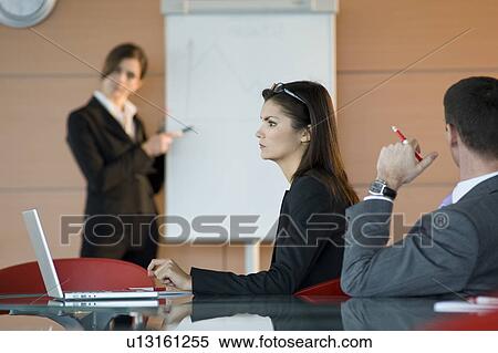 Business people at a presentation View Large Photo Image Stock Photography - Business people at a presentation. Fotosearch