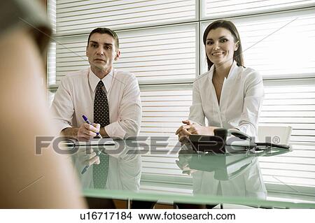 Business people interviewing professional woman View Large Photo Image Picture - Business people interviewing professional woman. Fotosearch