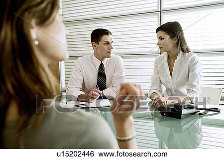 Business people interviewing professional woman View Large Photo Image Stock Photograph - Business people interviewing professional woman. Fotosearch