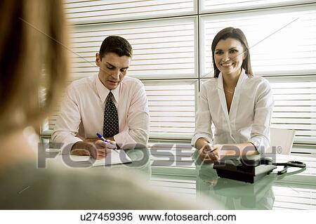 Business people interviewing professional woman View Large Photo Image Stock Photograph - Business people interviewing professional woman. Fotosearch