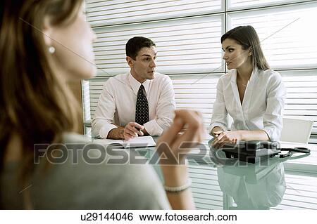 Business people interviewing professional woman View Large Photo Image Stock Photograph - Business people interviewing professional woman. Fotosearch