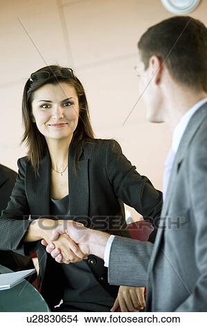 Picture - Business people shaking hands. Fotosearch