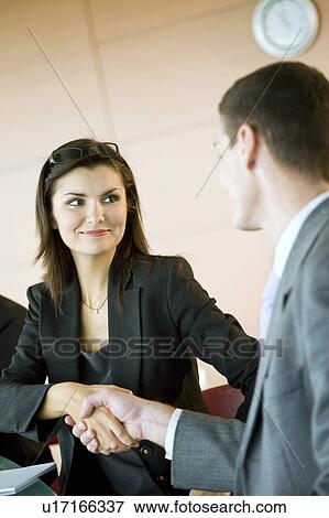 Stock Photo - Business people shaking hands. Fotosearch