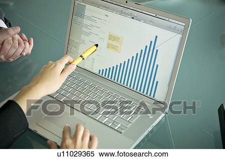 Business people's hands with laptop showing bar chart View Large Photo Image Stock Photography - Business people's hands with laptop showing bar chart. Fotosearch