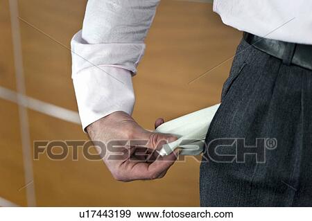 Businessman pulling out empty pocket View Large Photo Image Stock Photo - Businessman pulling out empty pocket. Fotosearch