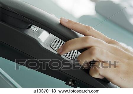 Stock Photo - Closeup of woman's hand on telephone. Fotosearch