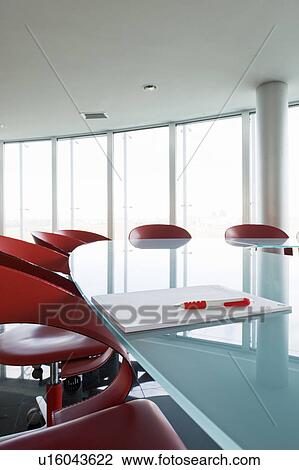 Stock Image - Notepad and pen on conference table. Fotosearch