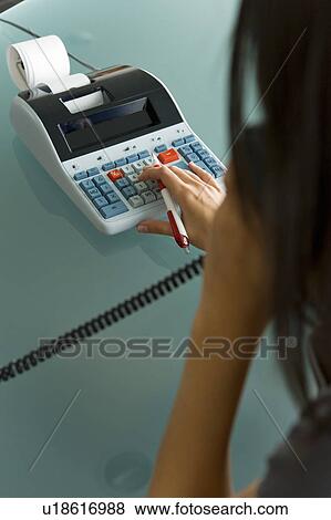Professional woman on telephone using calculator View Large Photo Image Stock Photo - Professional woman on telephone using calculator. Fotosearch