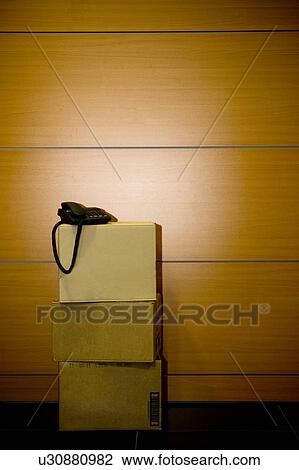 Telephone on cardboard boxes in office View Large Photo Image Stock Image - Telephone on cardboard boxes in office. Fotosearch