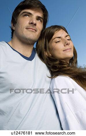 Young couple closeup outdoors View Large Photo Image Stock Image - Young couple closeup outdoors. Fotosearch