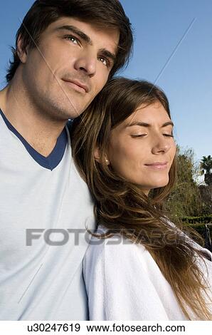 Young couple closeup outdoors View Large Photo Image Stock Photo - Young couple closeup outdoors. Fotosearch