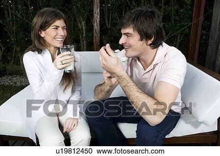 Young couple having breakfast outdoors View Large Photo Image Stock Image - Young couple having breakfast outdoors. Fotosearch