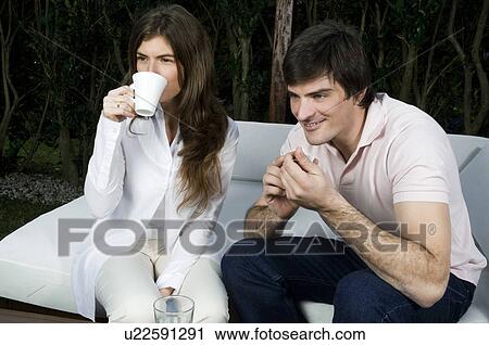 Young couple having breakfast outdoors View Large Photo Image Stock Image - Young couple having breakfast outdoors. Fotosearch