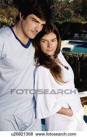Young couple on balcony in pajamas and bathrobe View Large Photo Image Stock Photo - Young couple on balcony in pajamas and bathrobe. Fotosearch