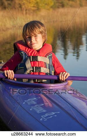 Picture - 10 year old boy in kayak, Lake Katherine, Riding Mountain National Park, Manitoba. Fotosearch
