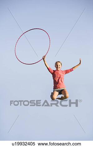11 year old girl jumps high with hoop, Winnipeg, Canada View Large Photo Image Stock Photography - 11 year old girl jumps high with hoop, Winnipeg, Canada. Fotosearch