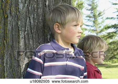 2 brothers standing beside tree, Winnipeg, Canada View Large Photo Image Stock Photography - 2 brothers standing beside tree, Winnipeg, Canada. Fotosearch