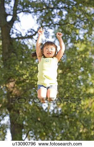 6 year old girl jumping, Winnipeg, Canada View Large Photo Image Stock Photograph - 6 year old girl jumping, Winnipeg, Canada. Fotosearch
