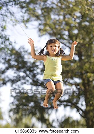 6 year old girl jumping, Winnipeg, Canada View Large Photo Image Stock Photography - 6 year old girl jumping, Winnipeg, Canada. Fotosearch