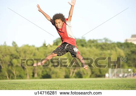 8 year old boy doing star jump, Winnipeg, Canada View Large Photo Image Stock Image - 8 year old boy doing star jump, Winnipeg, Canada. Fotosearch