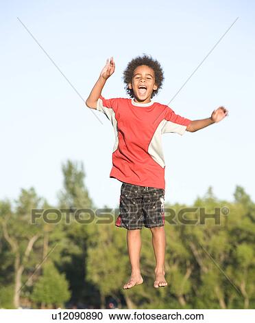 8 year old boy jumping, Winnipeg, Canada View Large Photo Image Stock Image - 8 year old boy jumping, Winnipeg, Canada. Fotosearch