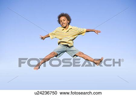 8 year old boy jumps very high, Winnipeg, Canada View Large Photo Image Stock Image - 8 year old boy jumps very high, Winnipeg, Canada. Fotosearch