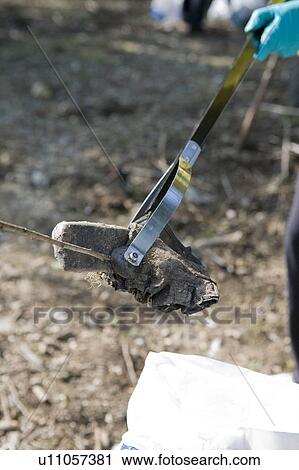 Stock Image - Close up of cleaning up Garbage, Vancouver, Canada. Fotosearch