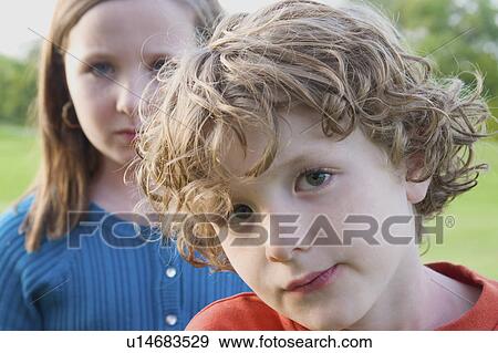 Close-up, Six year old brother in foreground, 8 year old sister in background, Winnipeg, Canada View Large Photo Image Stock Photo - Close-up, Six year old brother in foreground, 8 year old sister in background, Winnipeg, Canada. Fotosearch