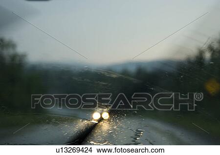 Driving on a rainy day with windshield wipers on, Canada View Large Photo Image Picture - Driving on a rainy day with windshield wipers on, Canada. Fotosearch