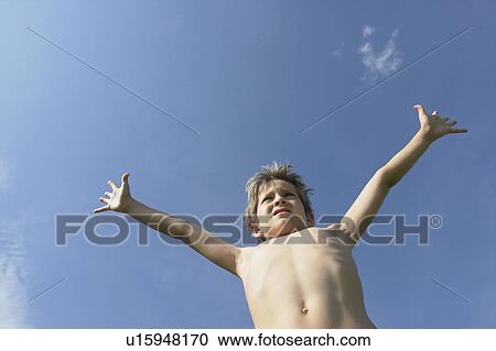 Eight year old boy with arms outstretched, Winnipeg, Canada View Large Photo Image Stock Image - Eight year old boy with arms outstretched, Winnipeg, Canada. Fotosearch