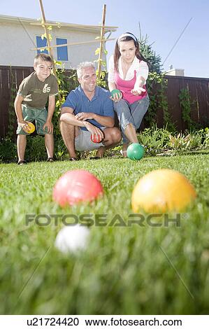 Family play bocce ball in backyard, Winnipeg, Canada View Large Photo Image Stock Image - Family play bocce ball in backyard, Winnipeg, Canada. Fotosearch
