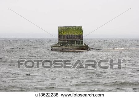 Stock Photo - Fishing Cabin at high tide in Blue Rocks, Nova Scotia. Fotosearch