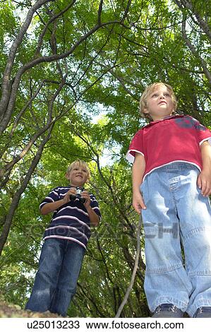 Four and six year old brothers on walking trail in forest, Winnipeg, Canada View Large Photo Image Stock Image - Four and six year old brothers on walking trail in forest, Winnipeg, Canada. Fotosearch