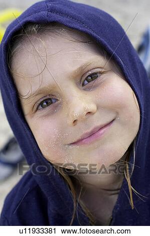 Stock Image - Girl with sand on her face, CamagÃƒÂ¼ey, Cuba. Fotosearch