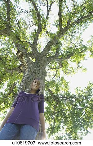 Low angle, 13 year old girl beside tree, Winnipeg, Canada View Large Photo Image Stock Photo - Low angle, 13 year old girl beside tree, Winnipeg, Canada. Fotosearch