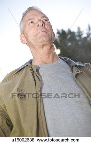 Stock Photo - Low angle portrait senior man, Winnipeg, Canada. Fotosearch