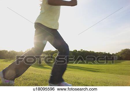 Lower portion of eight year old girl running in park, Winnipeg, Canada View Large Photo Image Stock Photograph - Lower portion of eight year old girl running in park, Winnipeg, Canada. Fotosearch