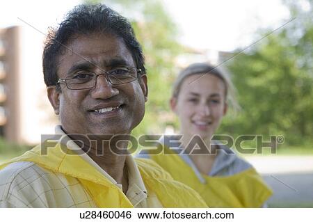Stock Photograph - Male and Female Portraits after Cleaning up under Bridge, Vancouver, Canada. Fotosearch