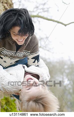 Mother and son laughing as son leans backward, Vancouver, British Columbia View Large Photo Image Stock Image - Mother and son laughing as son leans backward, Vancouver, British Columbia. Fotosearch
